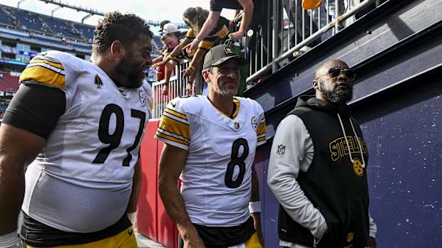 Pittsburgh Steelers defensive tackle Cameron Heyward (97) and Pittsburgh Steelers quarterback Aaron Rodgers (8) after the game at Gillette Stadium.